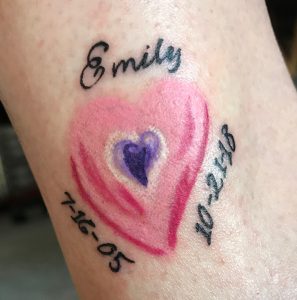 Suzy's heart-shaped tattoo in memory of Emily Harmon